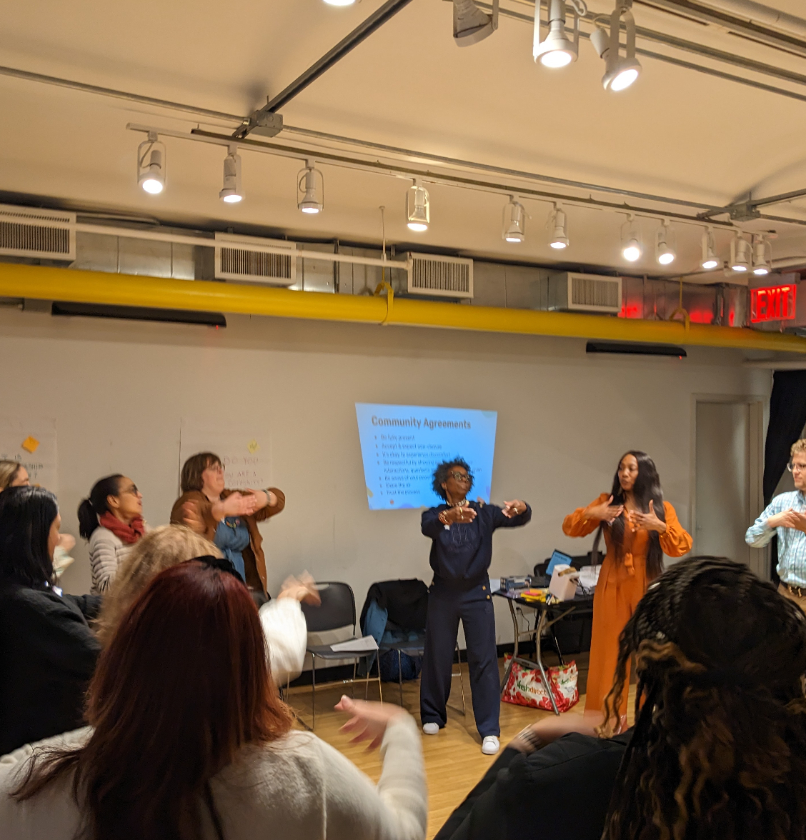 eachers-stand-in-circle-arms-out-and-coming-towards-their-chests - Mod 6