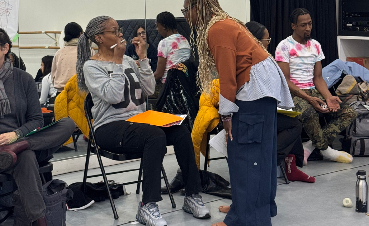 one teachers leans in to support another teacher